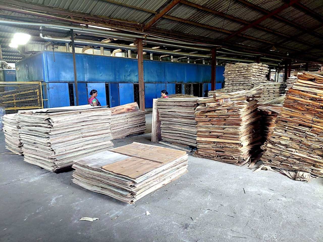 Stacks of wood veneer on the production floor