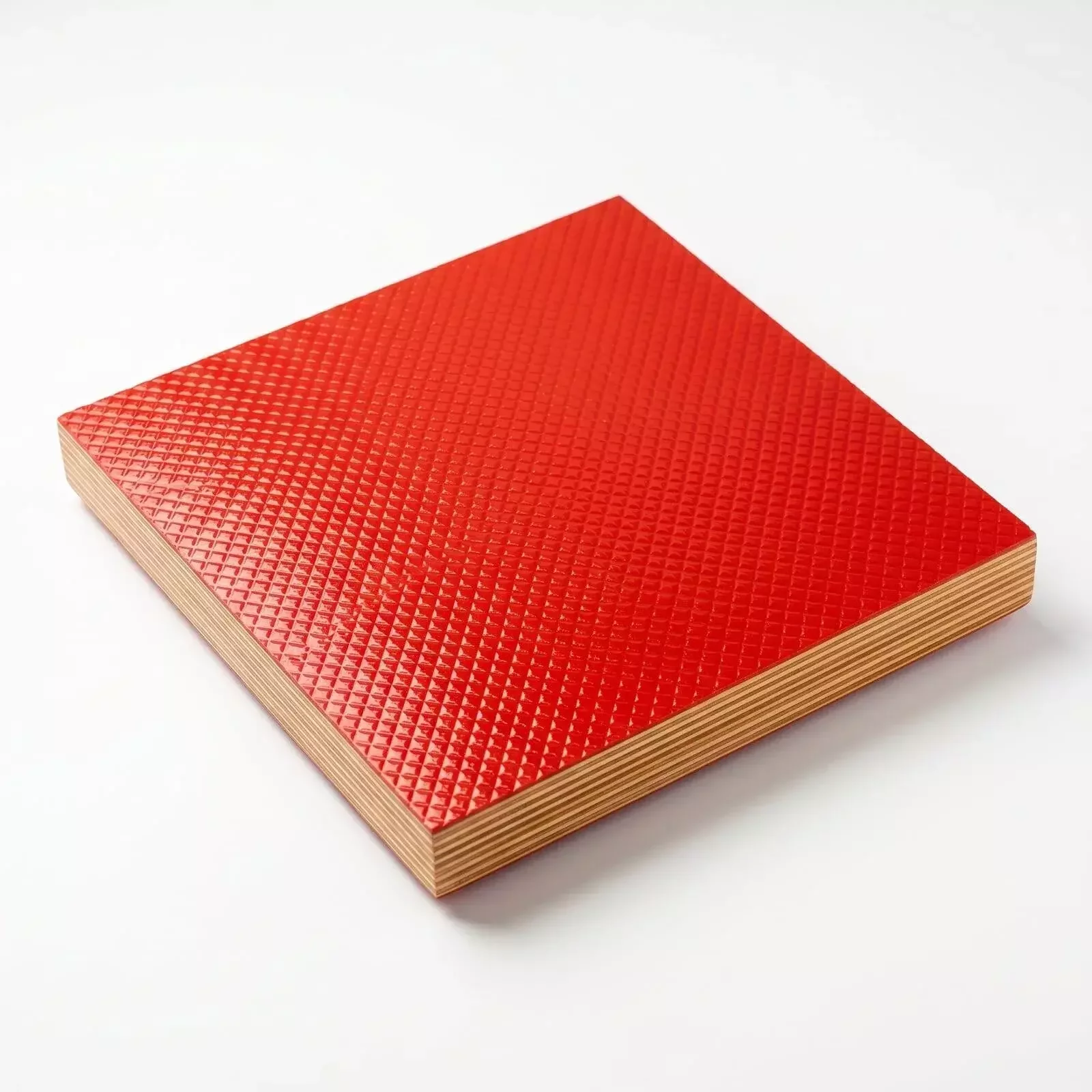 Chequered anti-skid plywood surface close-up showing diamond pattern