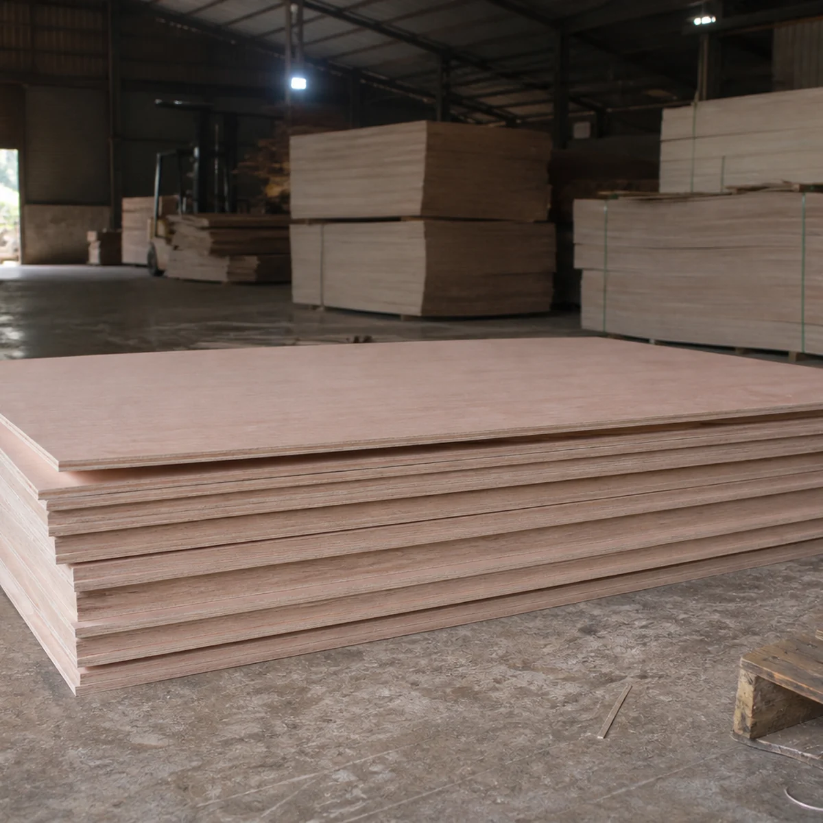 Plywood panels with smooth pinkish-brown faces and visible layered edges