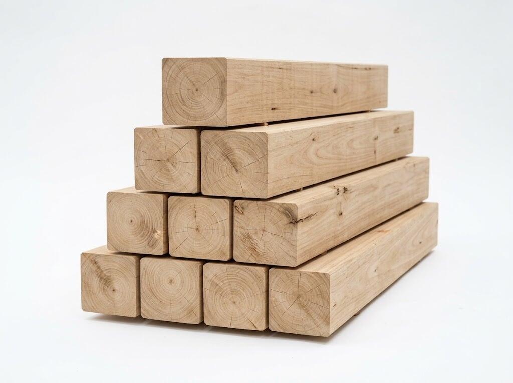 Kiln-dried eucalyptus beams stacked at the timber yard